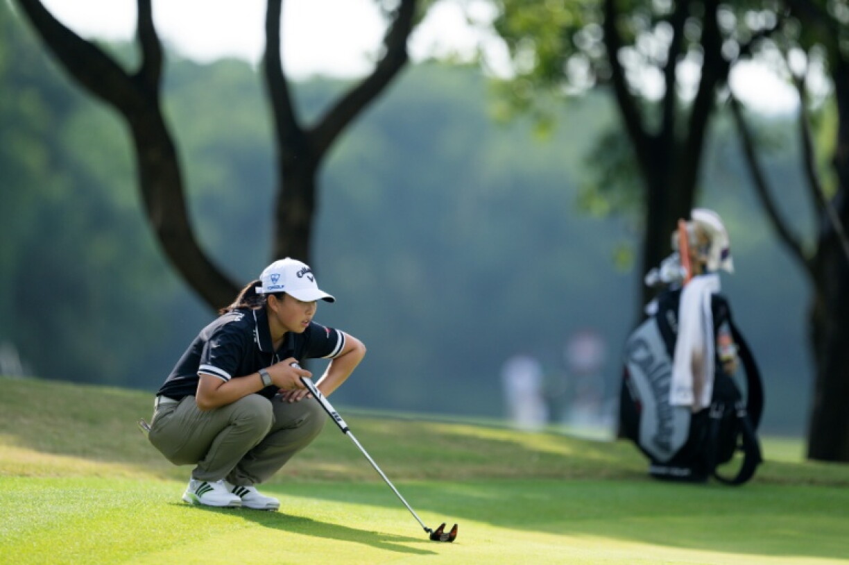 China's Yin Ruoning lines up a putt on Saturday