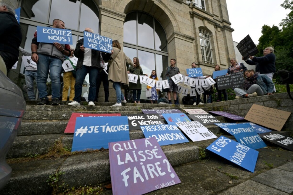 Survivors of French surgeon Joel Le Scouarnec's abuse staged a protest outside the court in Vannes in the western region of Brittany, holding signs such as 'Never again' and 'I accuse you'