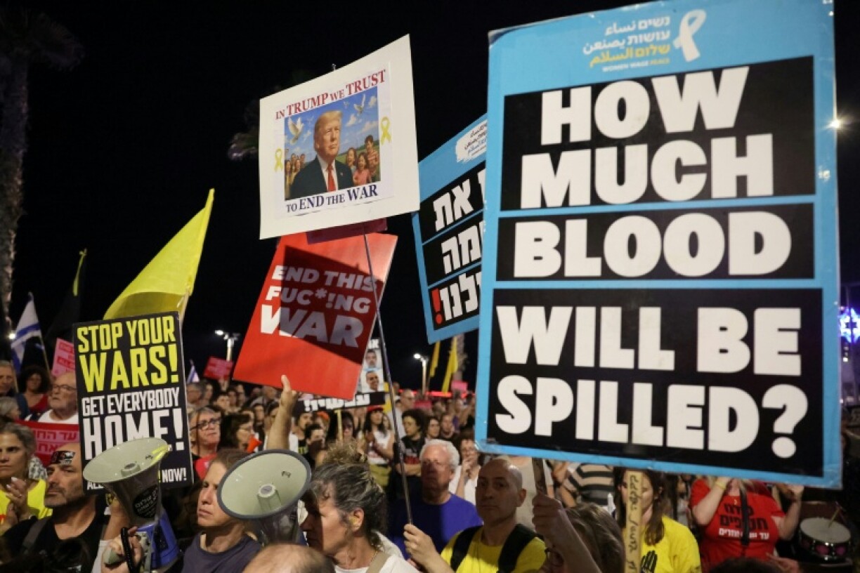 Supporters of the remaining Israeli hostages in Gaza demonstrate outside the US embassy branch in Tel Aviv to urge US intervention to secure their negotiated release.