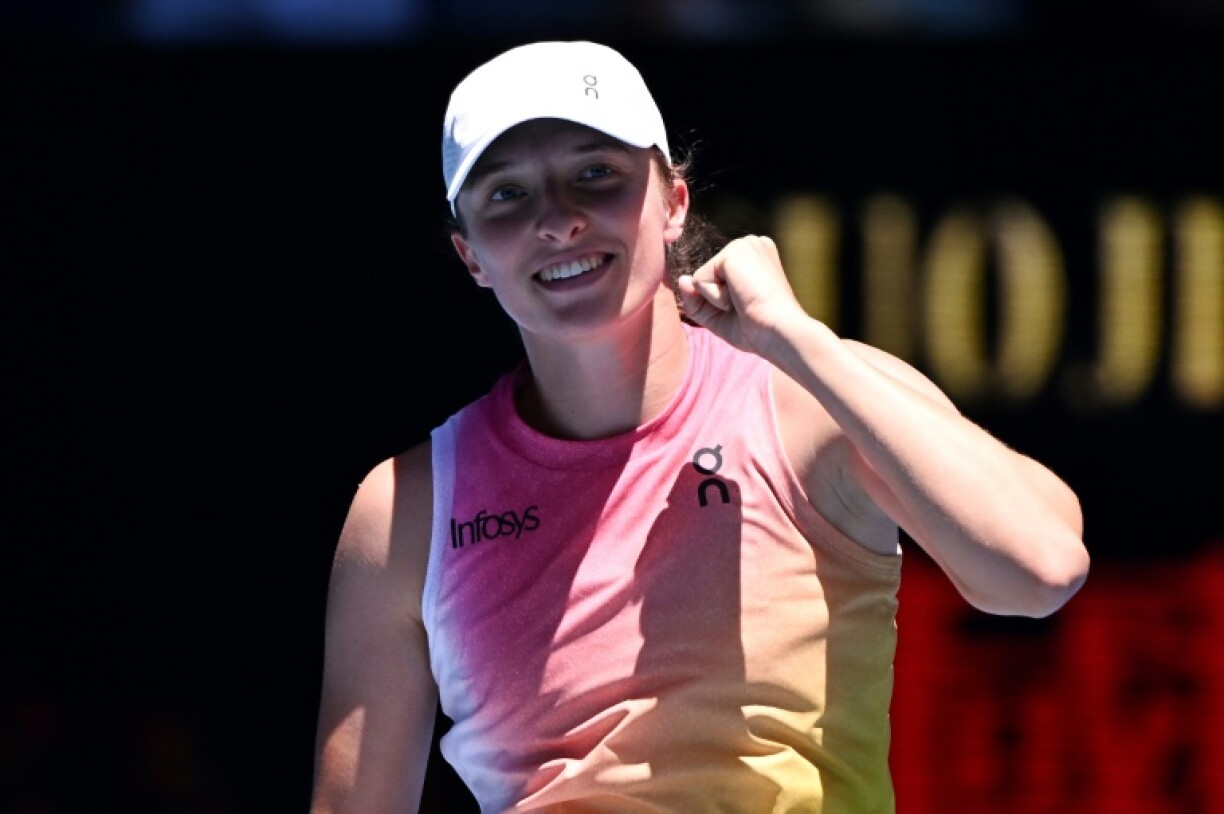 Poland's Iga Swiatek celebrates her rout of Britain's Emma Raducanu