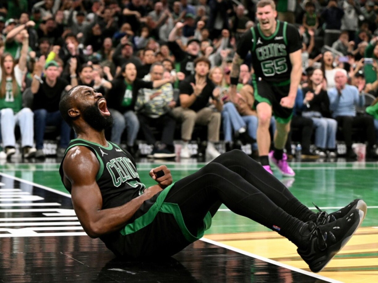 Boston's Jaylen Brown reacts after scoring a basket against Detroit in an NBA game where he scored 33 points to power the Celtics over the Pistons 117-114 and snap Detroit's 13-game win streak