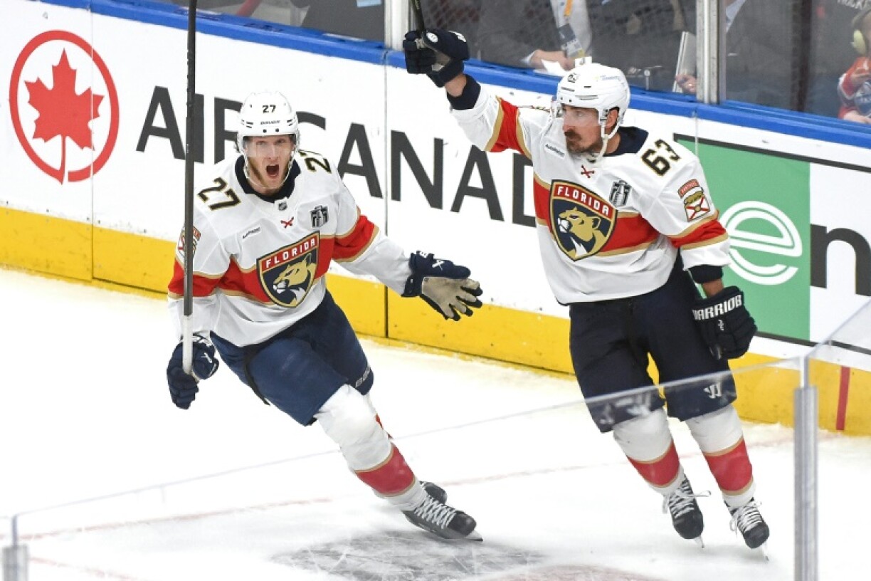 Brad Marchand of the Florida Panthers celebrates a goal with teammate Eetu Luostarinen in the Panthers' victory over the Edmonton Oilers in game five of the NHL Stanley Cup Final