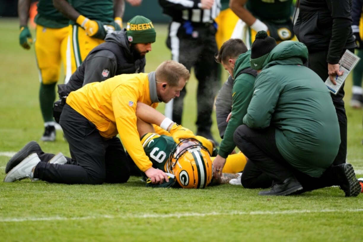 Christian Watson of the Green Bay Packers is attended to after being injured in the second quarter against the Chicago Bears at Lambeau Field on Sunday.