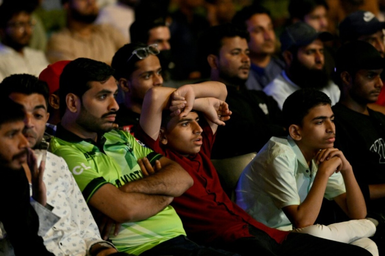 Death of a dream: Cricket fans in Karachi watch a live broadcast of the Champions Trophy match between India and Pakistan on a big screen