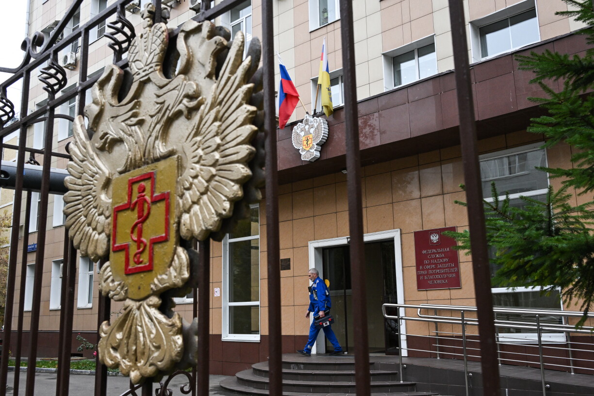 A maintenance worker walks out of the headquarters of Russia's consumer and health watchdog Rospotrebnadzor in Moscow on October 5, 2026.