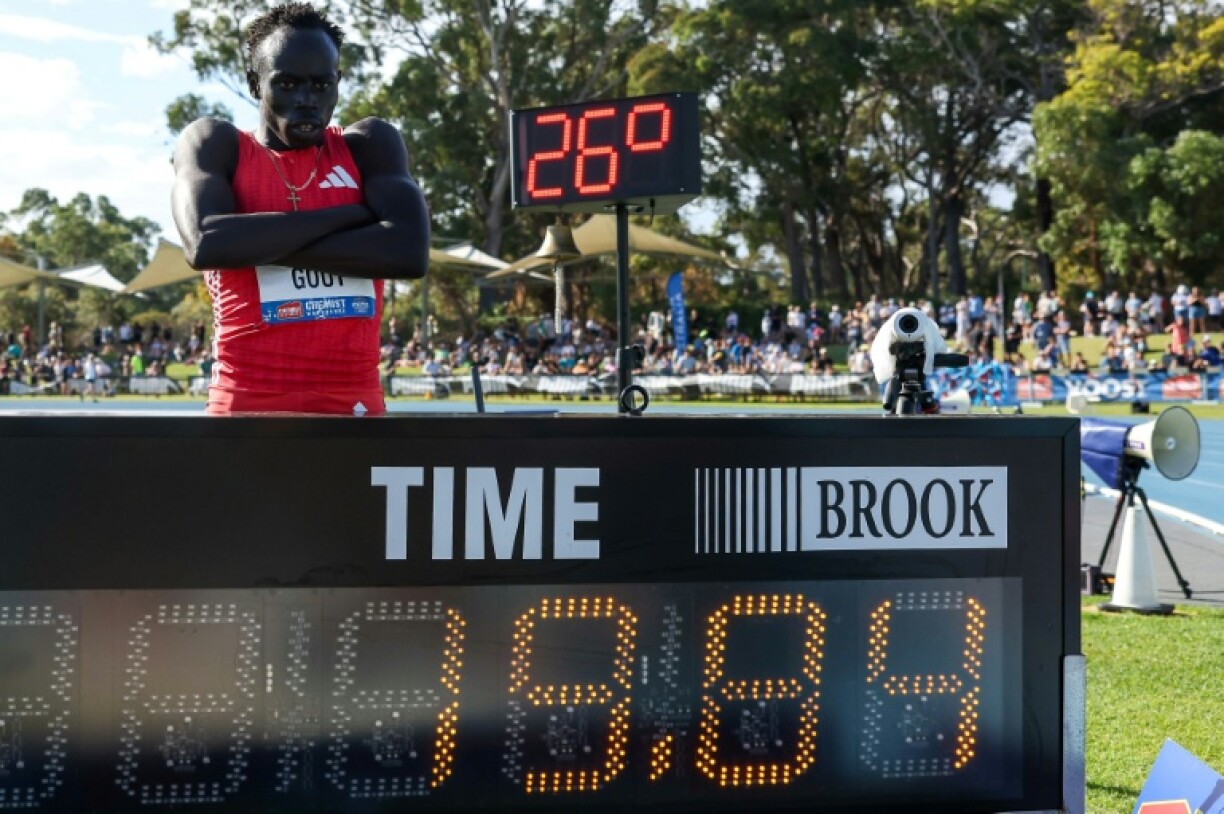 Australia's Gout Gout poses next to his time of 19.84 after winning the men's 200m final during the Australian Athletics Championships in Perth