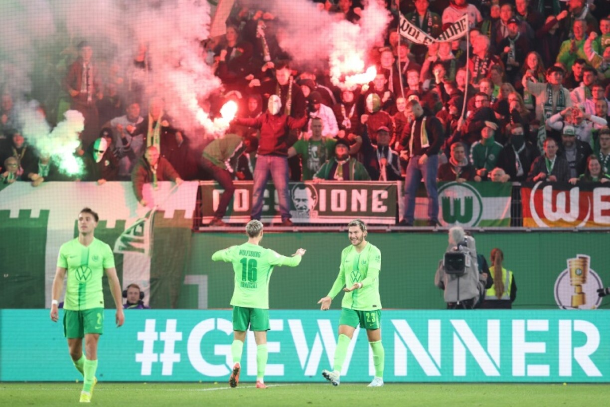 Jonas Wind (R), seen here celebrating his goal in Wolfsburg's German Cup tie against Borussia Dortmund in October, scored a late brace to lift his side to fifth in the Bundesliga table