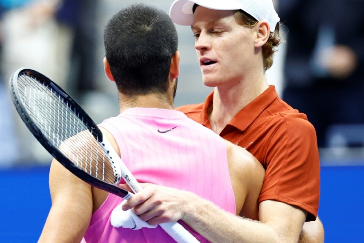 Jannik Sinner (right) says he must change his game to reignite his rivalry with Carlos Alcaraz