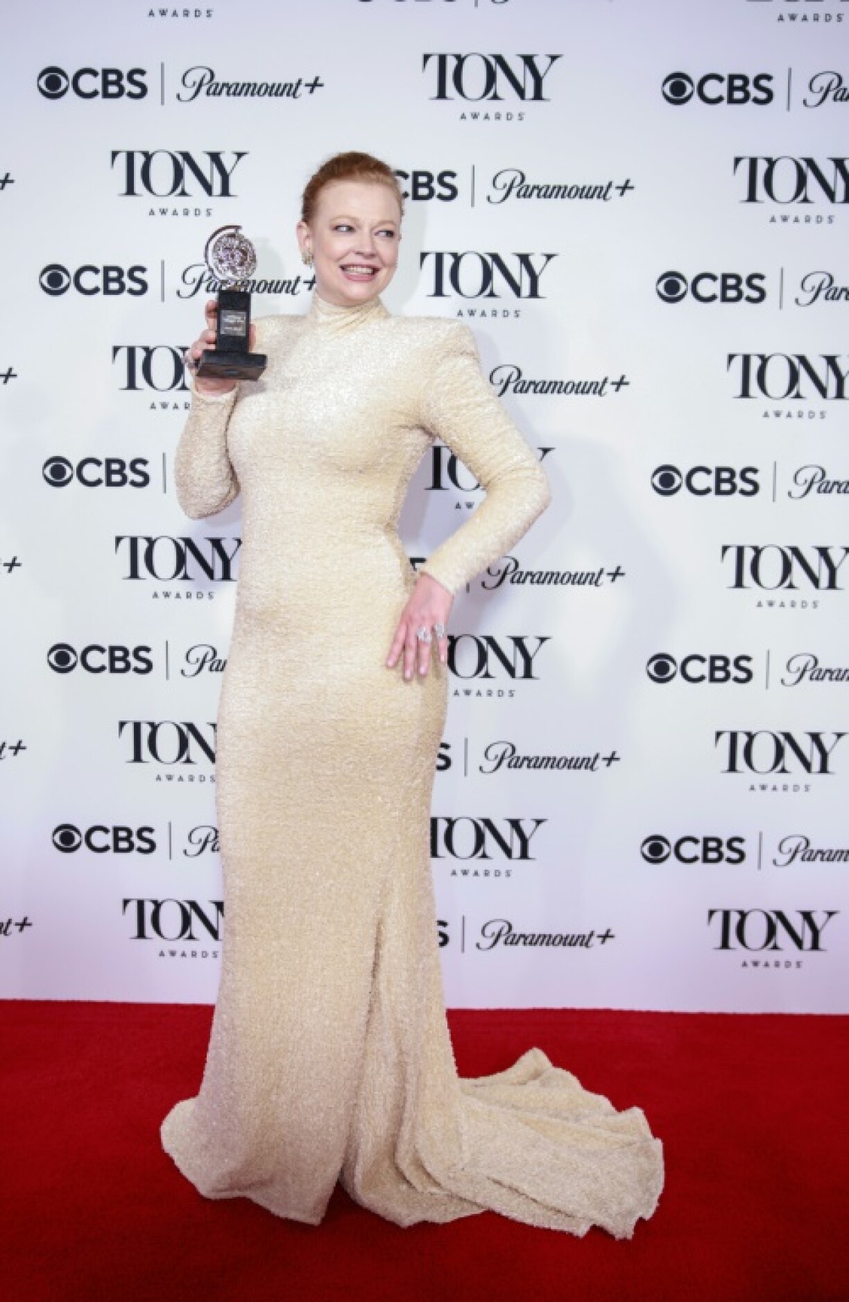 Sarah Snook poses with the Best Performance by an Actress in a Leading Role in a Play award for