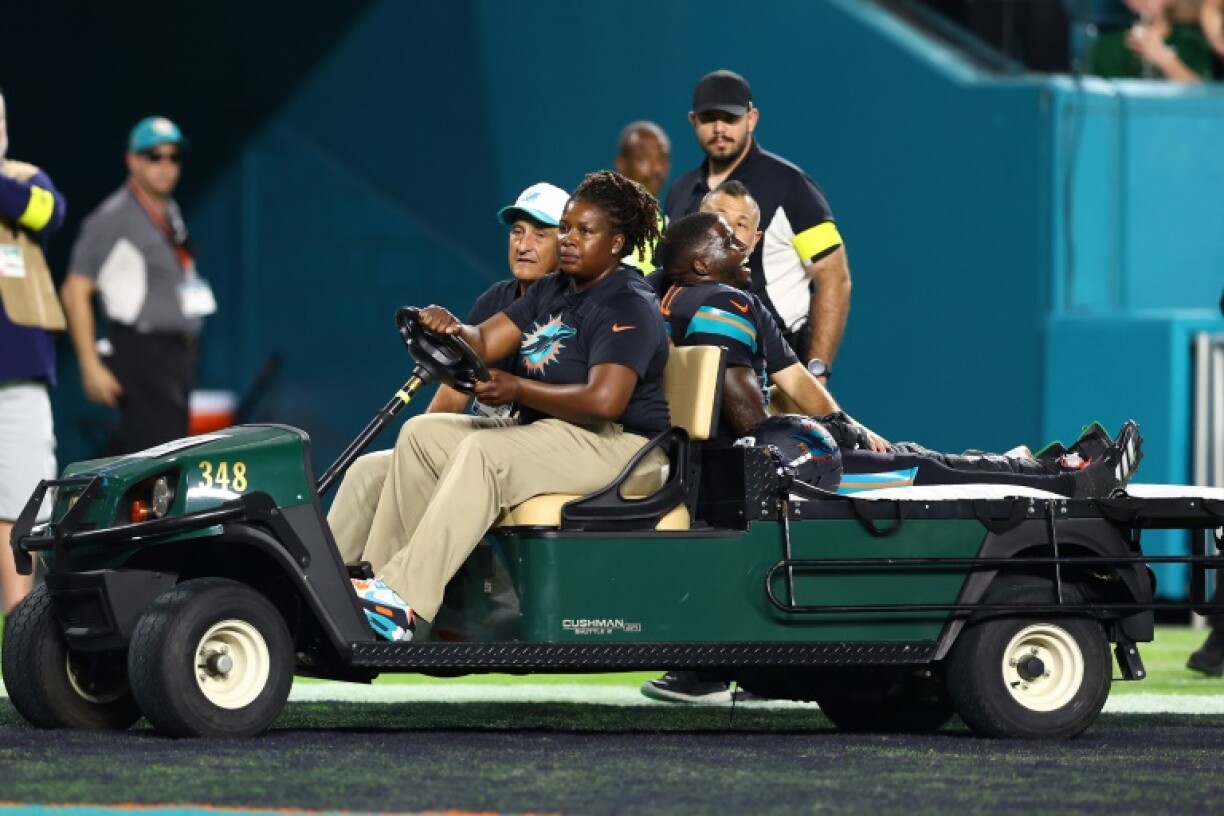 Miami Dolphins receiver Tyreek Hill is driven off the field after suffering a knee injury in his team's NFL game with the New York Jets