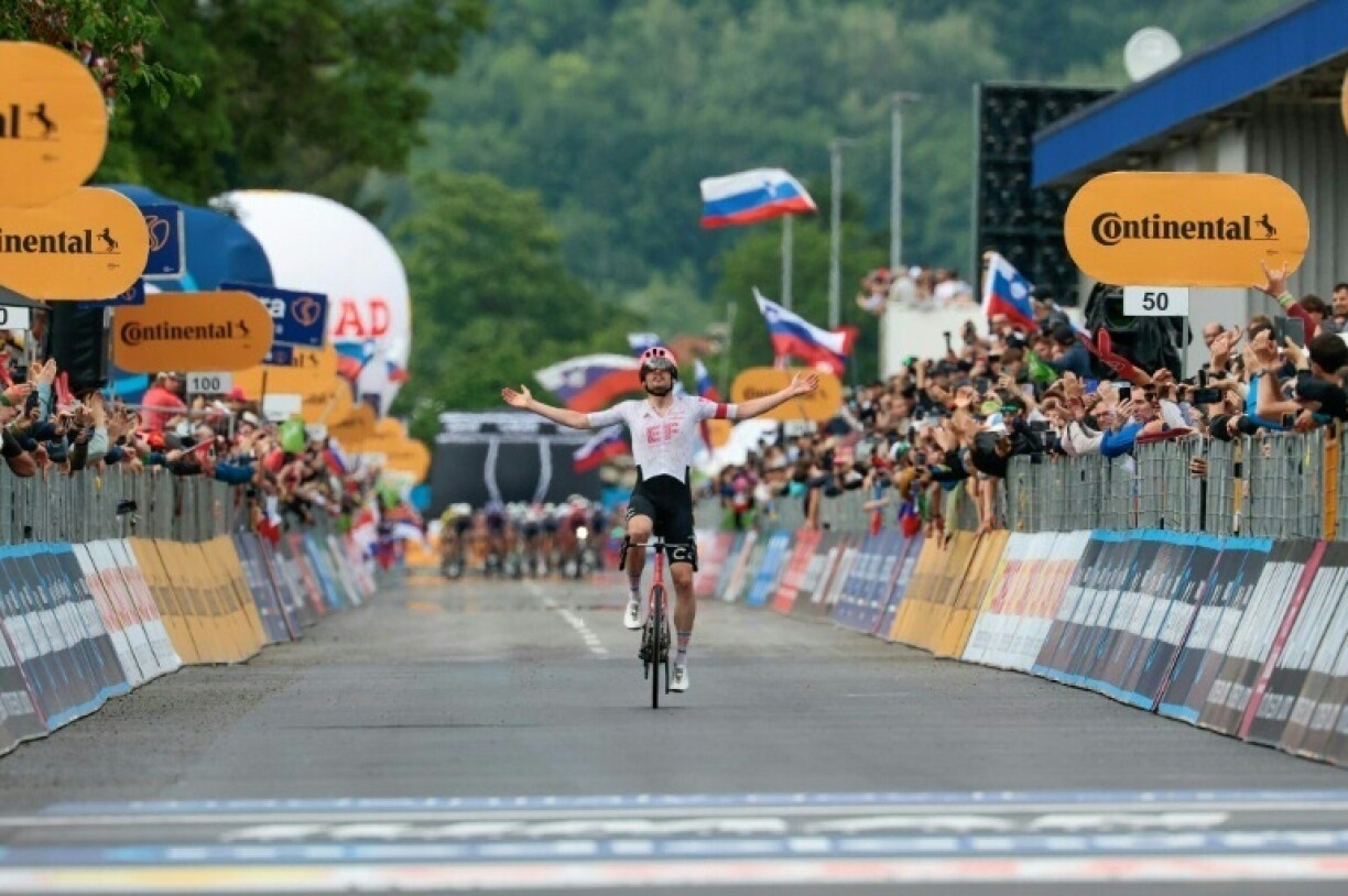 Kasper Asgreen crosses the line first to take the Giro's 14th stage in Nova Gorica, Slovenia.