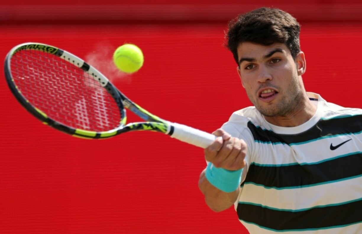 Spanish top seed Carlos Alcaraz in action against Australia's Adam Walton at Queen's