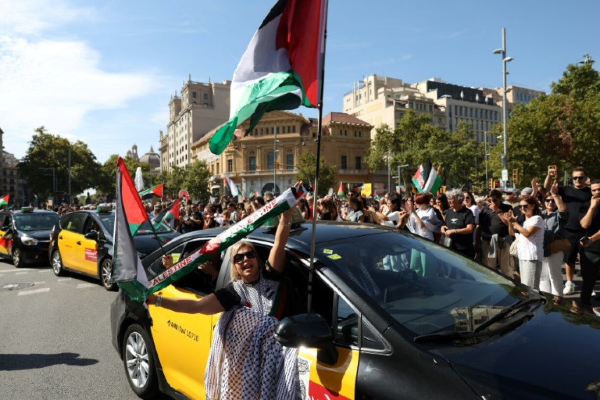 Tens of thousands rally in Barcelona behind a banner reading 'Stop the genocide in Palestine'