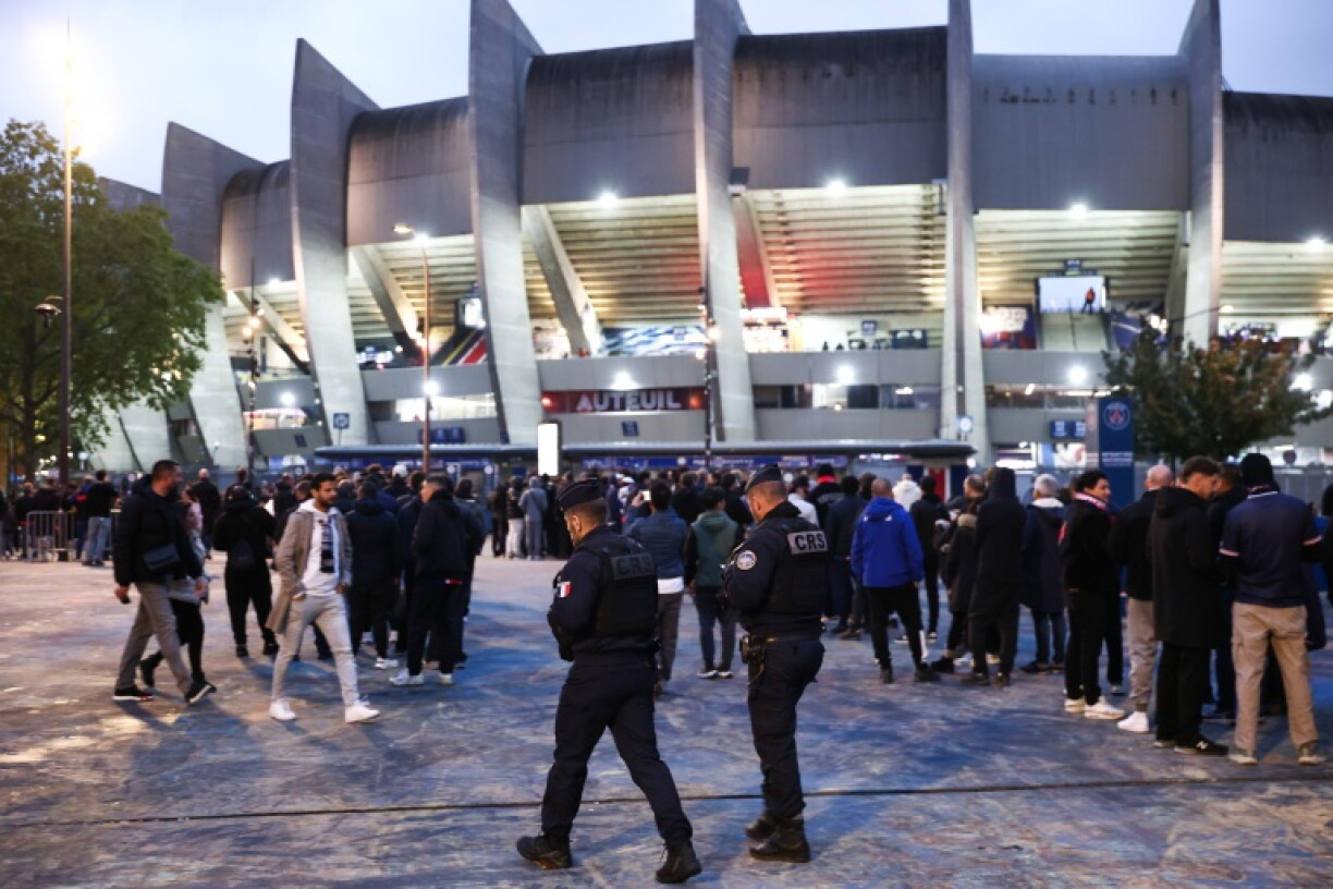 French riot police patrol outside the Parc des Princes before Paris Saint-Germain's Champions League match against Barcelona on Tuesday