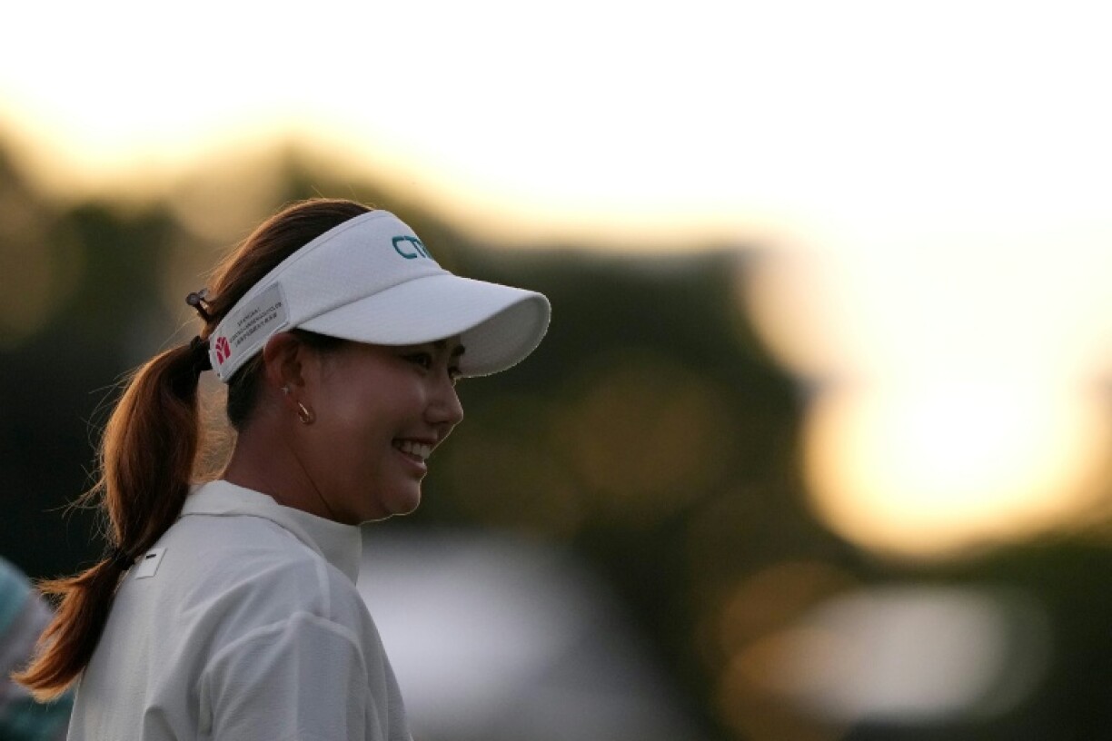 Miranda Wang of China reacts as she finishes out on the 18th hole with the 54-hole lead in the LPGA FM Championship at TPC Boston
