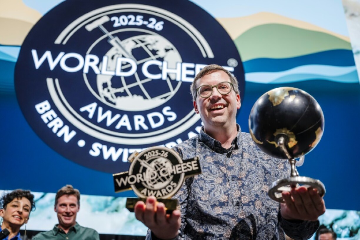 Swiss cheesemaker Pius Hitz, managing director of Bergkaserei Vorderfultigen, lifts the title