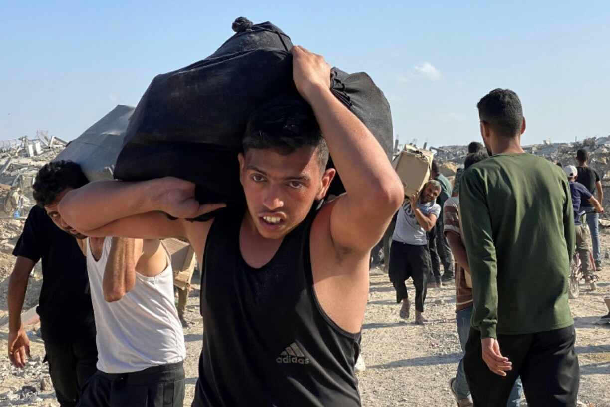 Palestinians receive food packages from a US-backed foundation in the southern Gaza Strip