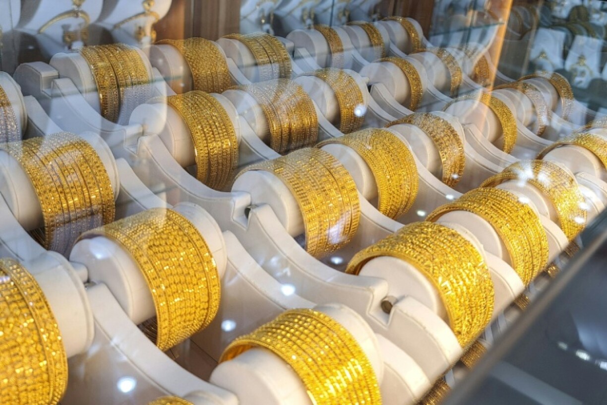 Gold bracelets displayed in a London shop as rising gold prices attract both buyers and sellers