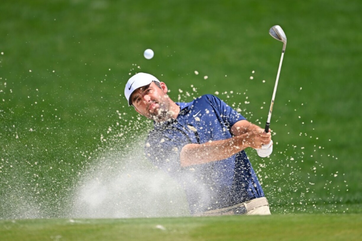 World number one Scottie Scheffler was tied with Spain's Jon Rahm as he began the back nine holes in Sunday's final round of the PGA Championship at Quail Hollow