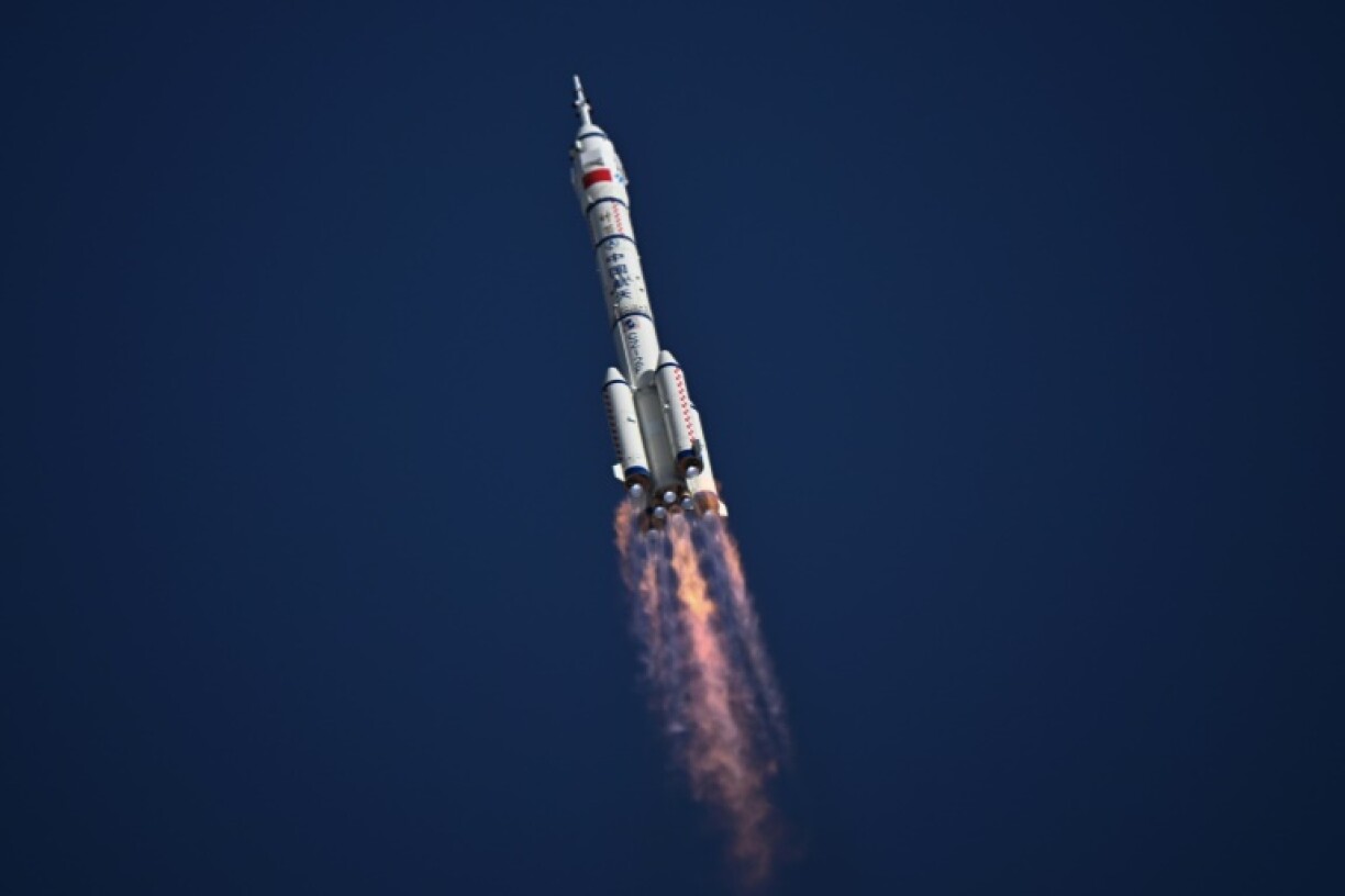 A Long March-2F carrier rocket, carrying the Shenzhou-20 spacecraft and a crew of three astronauts, lifts off