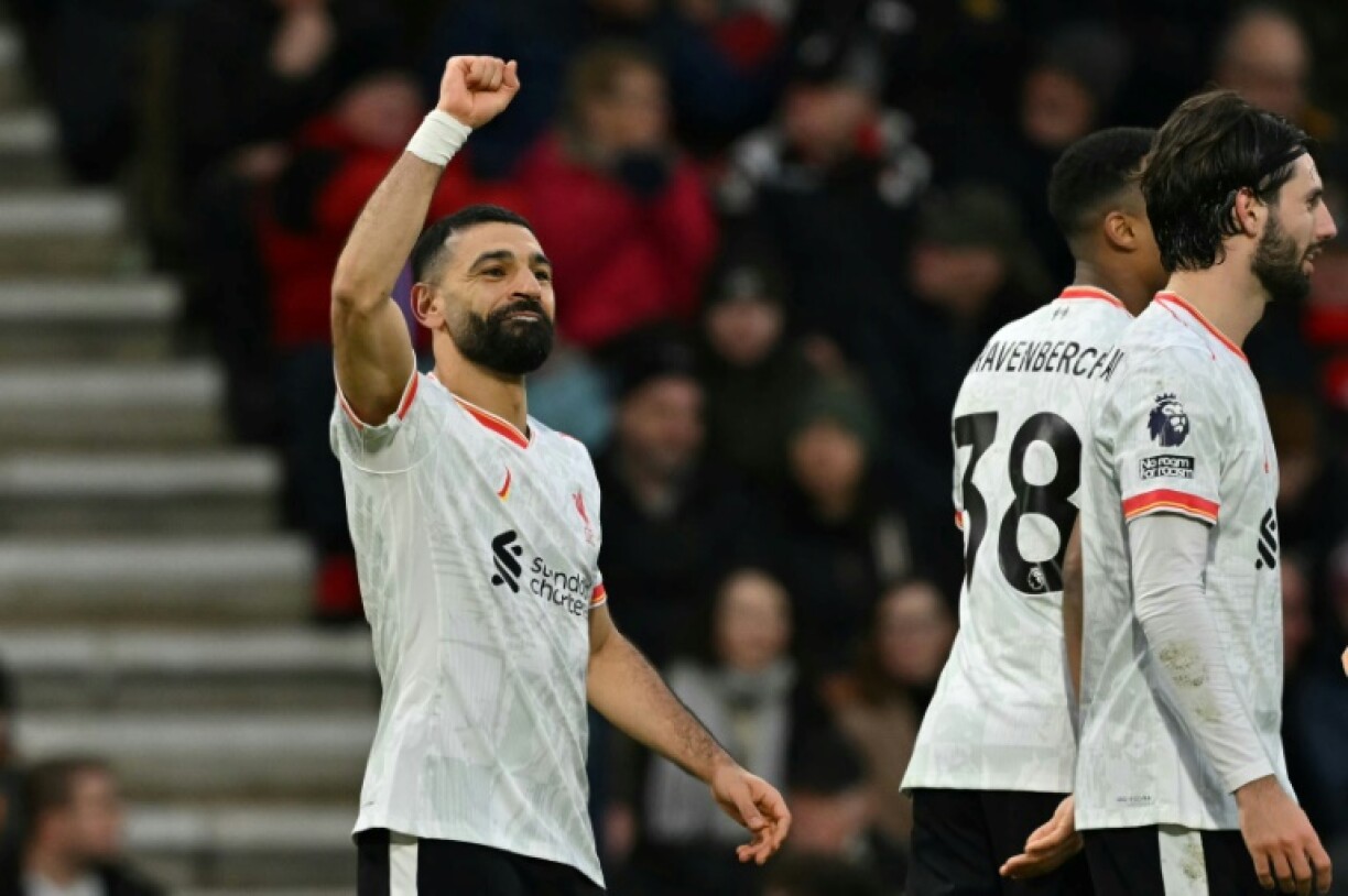 Mohamed Salah (left)scored twice in Liverpool's 2-0 win at Bournemouth