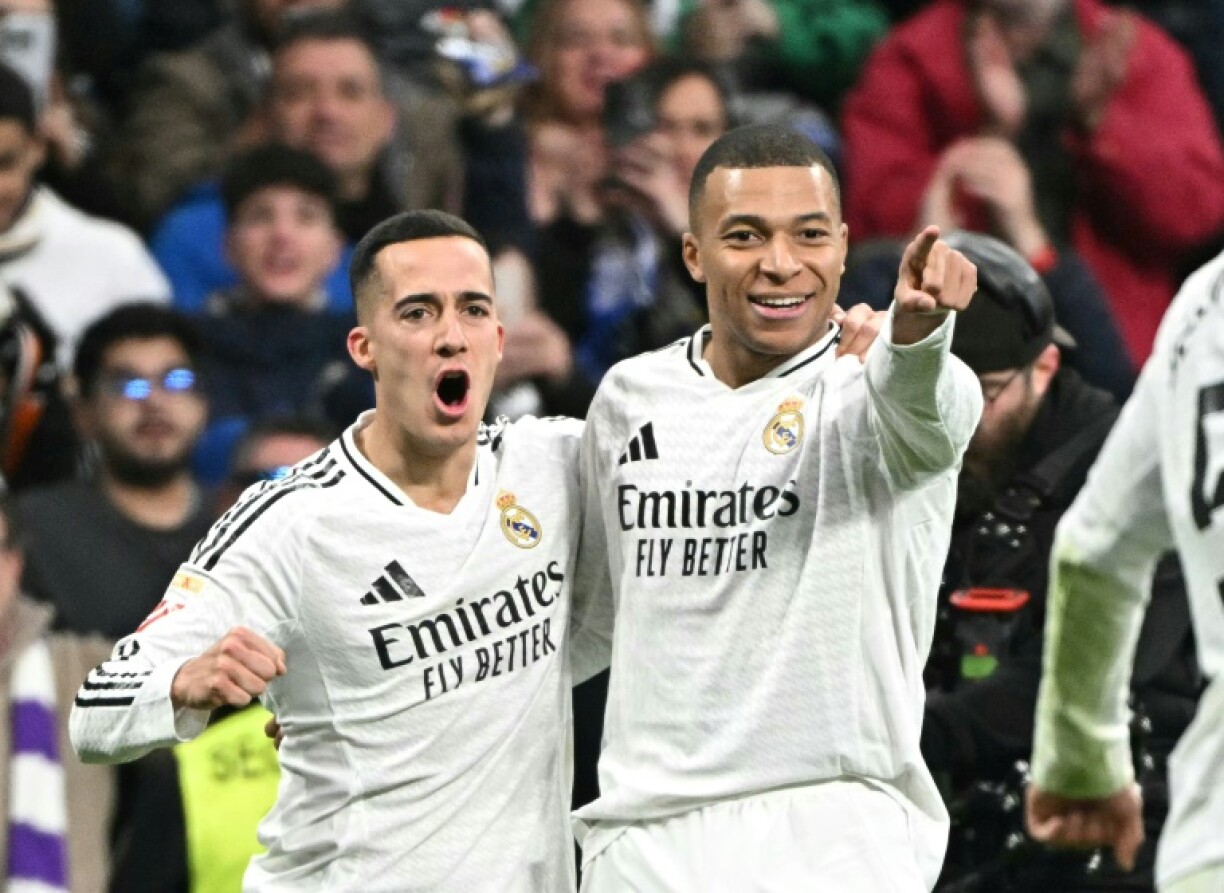 Real Madrid's French forward Kylian Mbappe celebrates scoring his team's third goal in the rout of Las Palmas