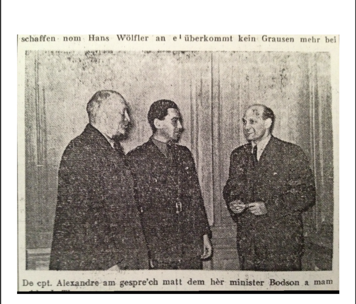 Captain Hanns Alexander (centre) pictured in Luxembourg with the Minister of Justice, Victor Bodson, and another official.