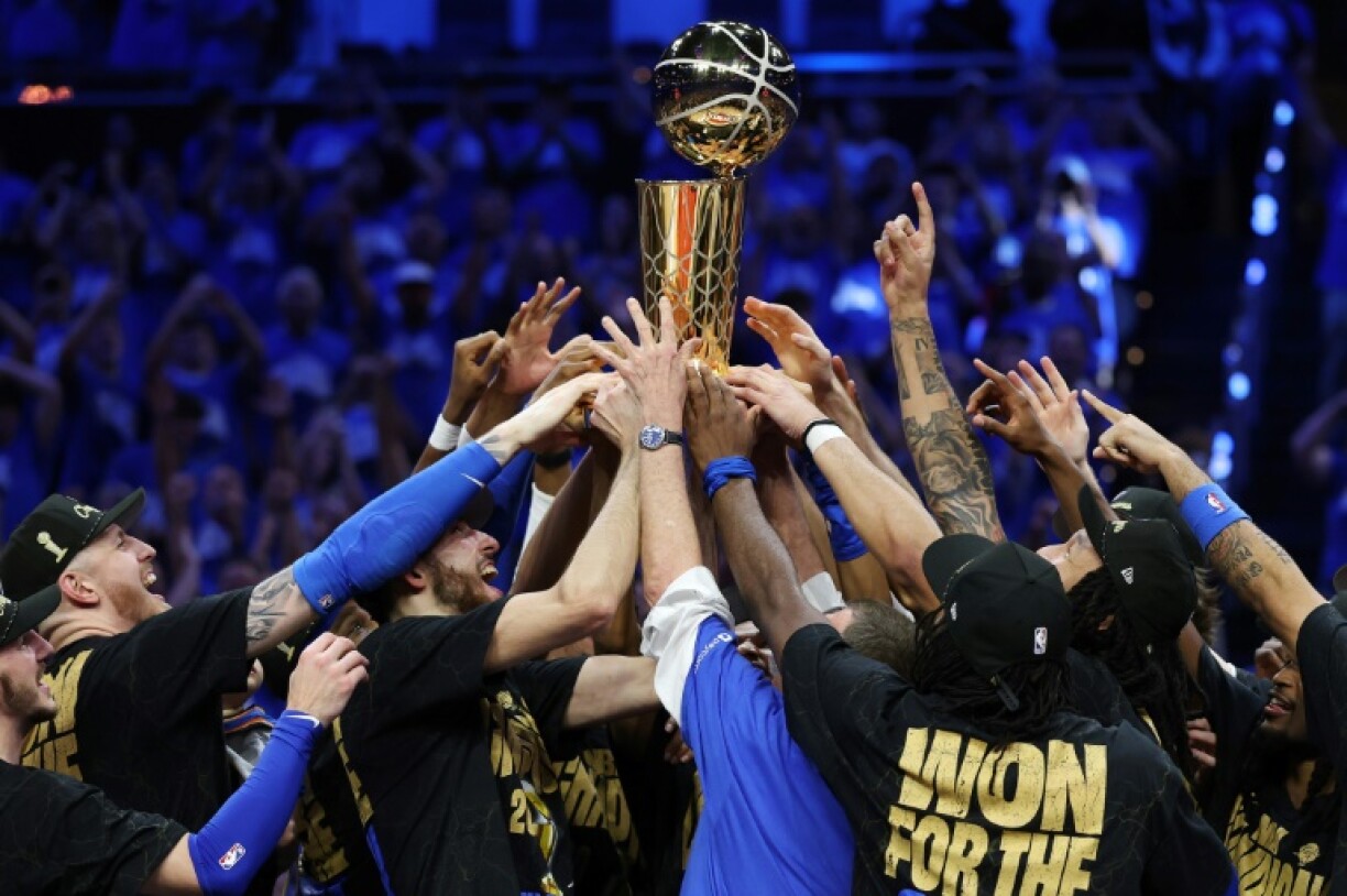 The Oklahoma City Thunder celebrate with the Larry O'Brien Championship Trophy after beating the Indiana Pacers in game seven of the NBA Finals