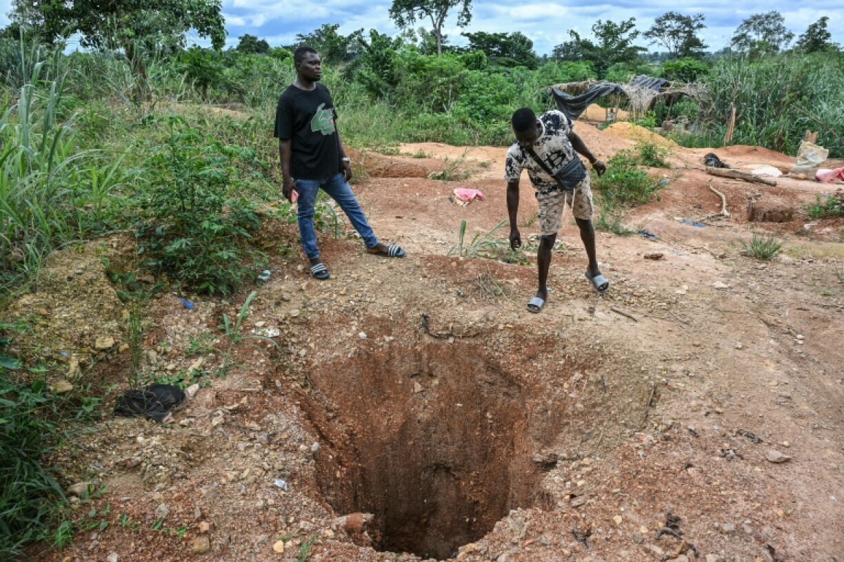 Prospectors leave gaping holes in the ground after illegally digging for gold
