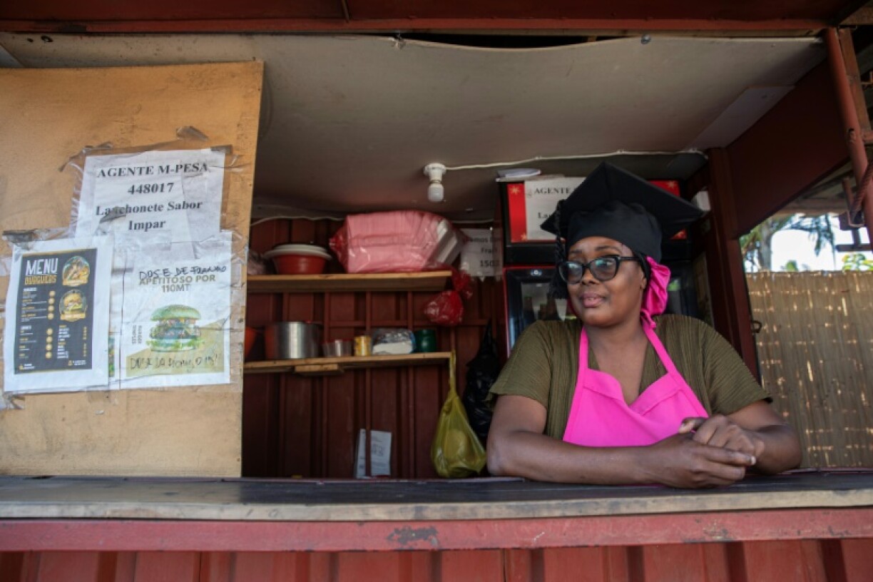 Despite having a university degree, Juvencia Bila works at a fast-food stand in Maputo because it is the only work she could find