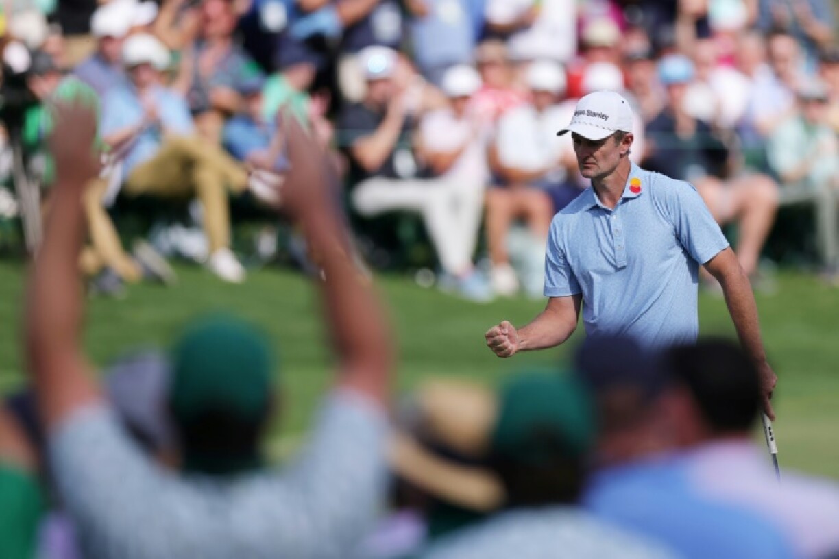 England's Justin Rose reacts after a birdie on the 16th hole on the way t the first-rund lead in the Masters at Augusta National