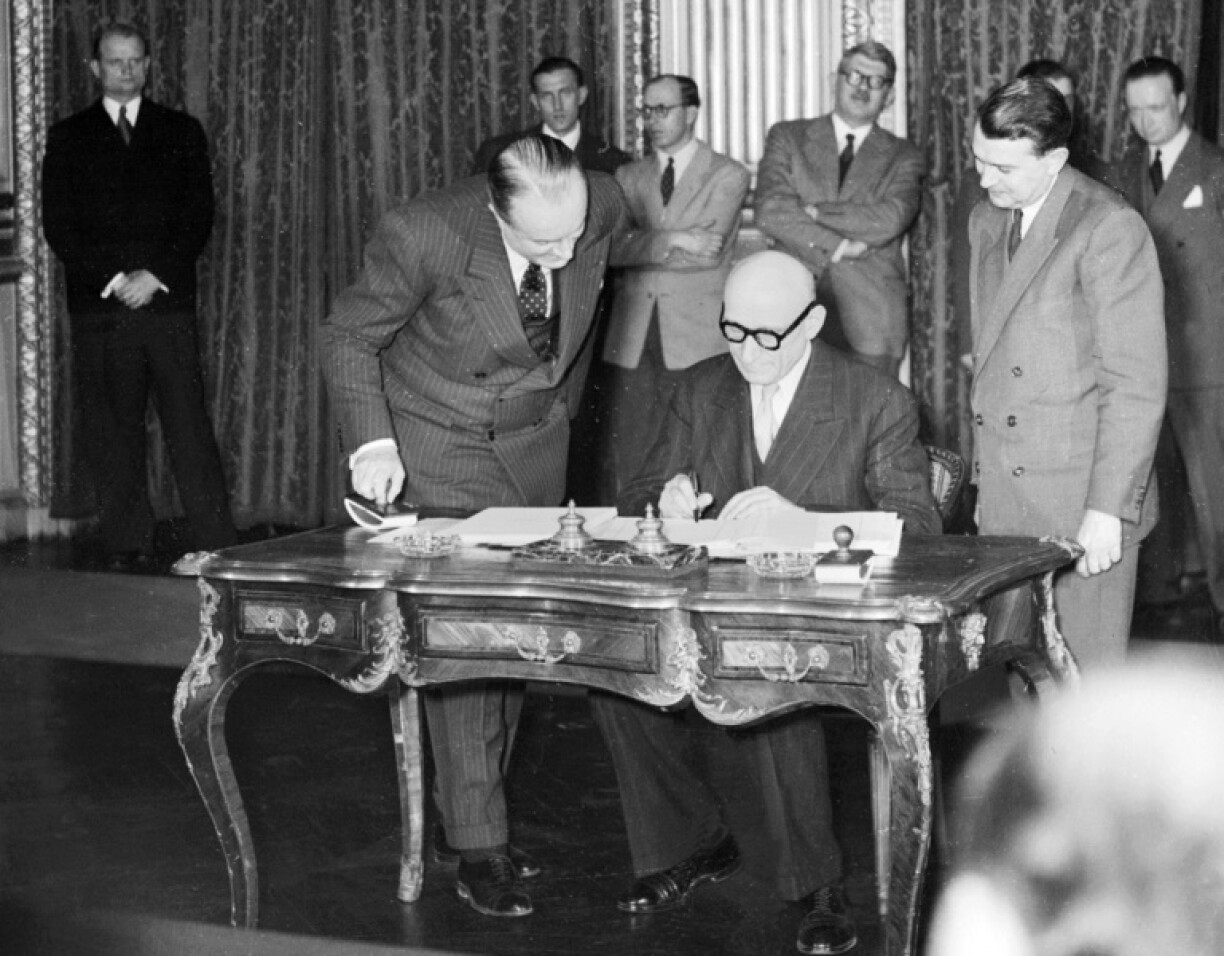 Robert Schuman signing documents making the ECSC official on 18 April 1951.