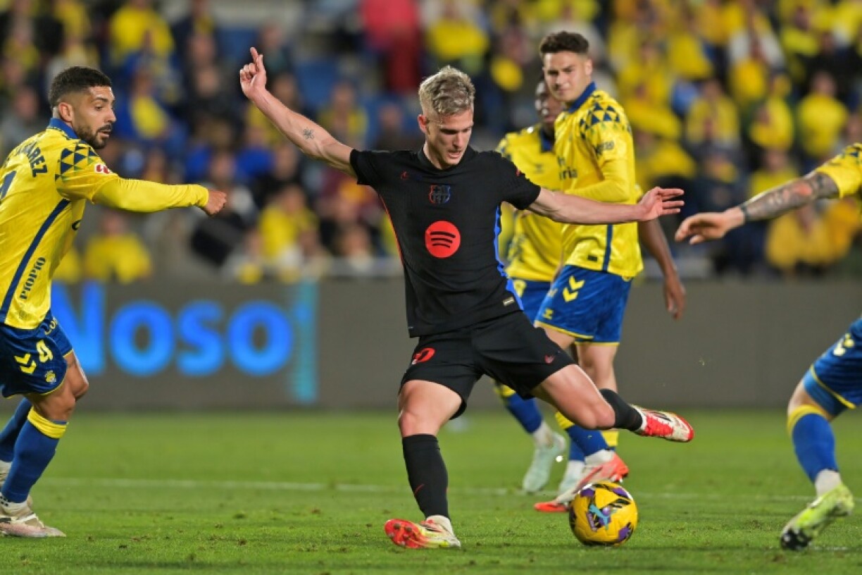 Barcelona midfielder Dani Olmo scored the opening goal as his side beat Las Palmas to keep hold of top spot in La Liga