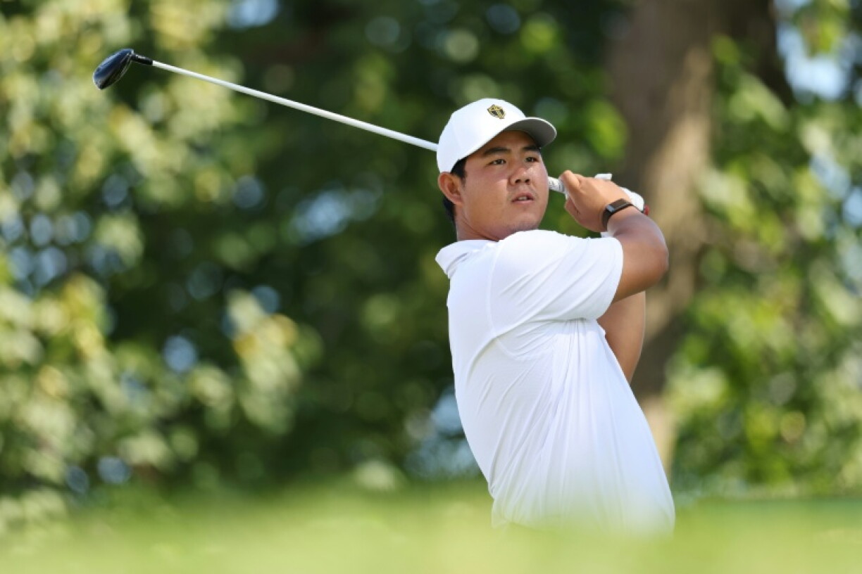Tom Kim and playing partners finished their second round at the Asian Games under temporary floodlights