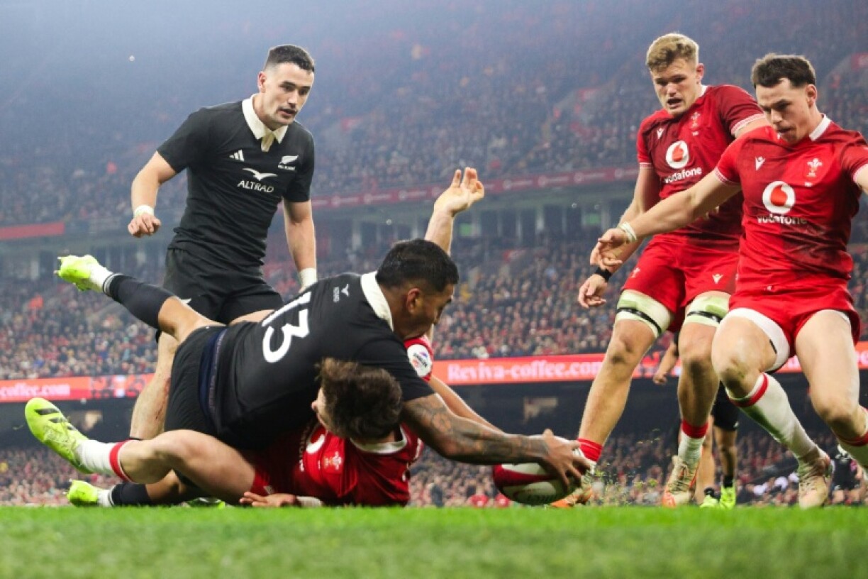 New Zealand's centre Rieko Ioane scores against Wales