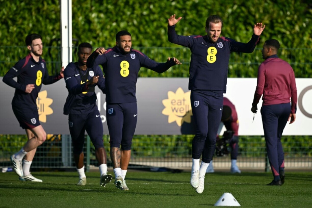 Leaping ahead: Harry Kane (R) takes part in an England training session with (L-R) Declan Rice, Marc Guehi and Reece James