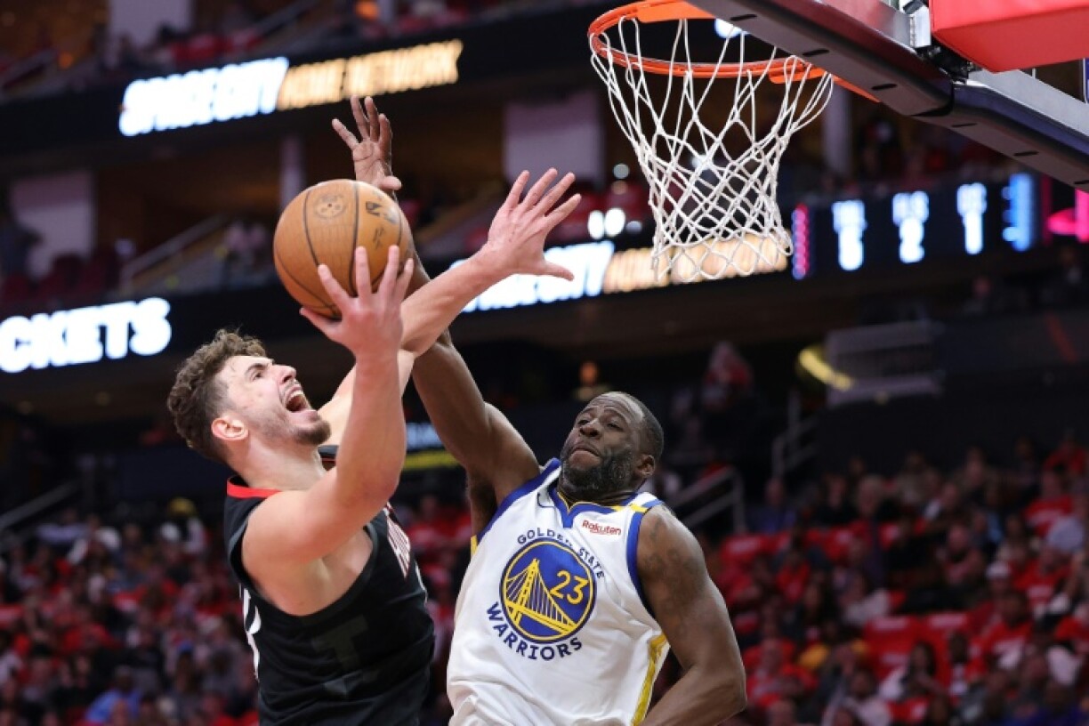 Alperen Sengun of the Houston Rockets shoots against Draymond Green in the Rockets' NBA Cup quarter-final victory over the Golden State Warriors