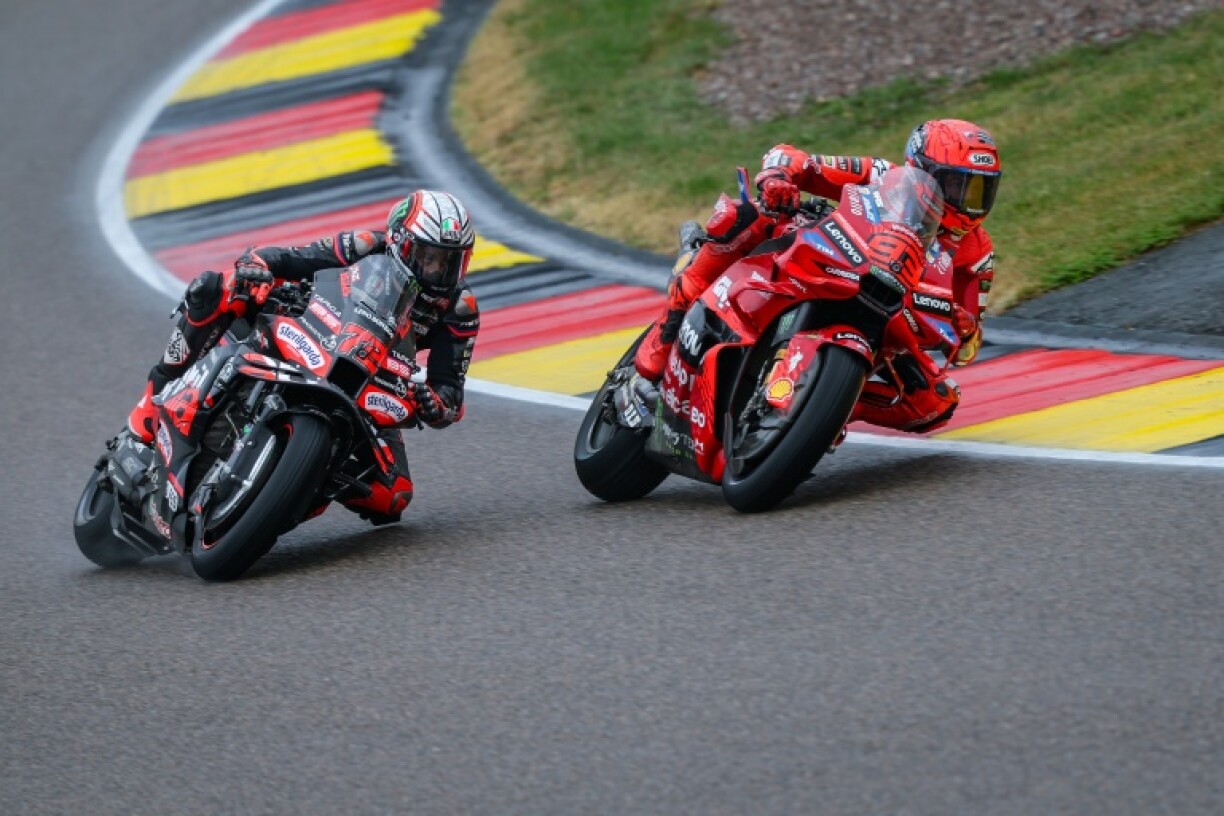 Marc Marquez (right) nabs Marco Bezzecchi on the last lap