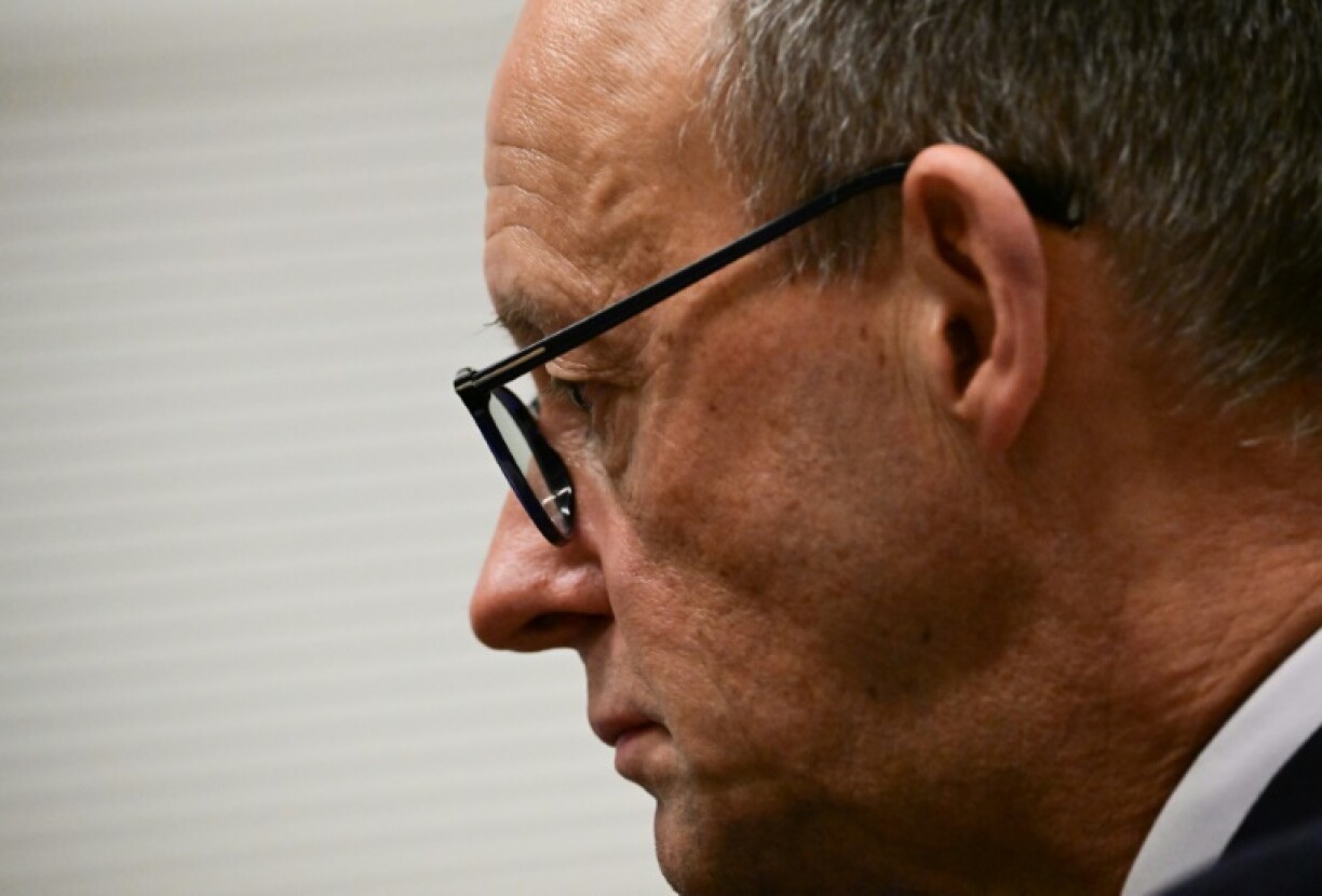 CDU leader Friedrich Merz gets ready to give a statement after German MPs narrowly voted against his party's bill to restrict immigration