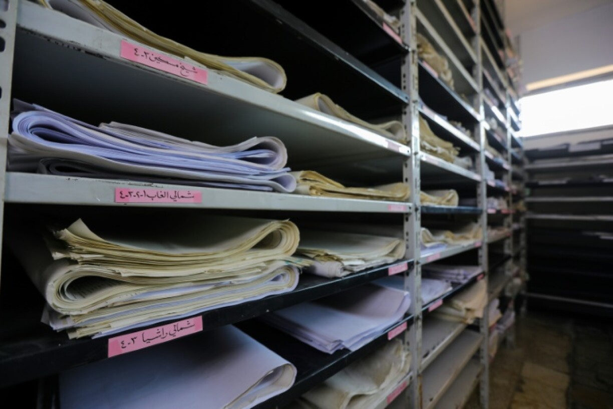 Documents in a room at the feared Fourth Divison's Security Bureau HQ on the edge of Damascus
