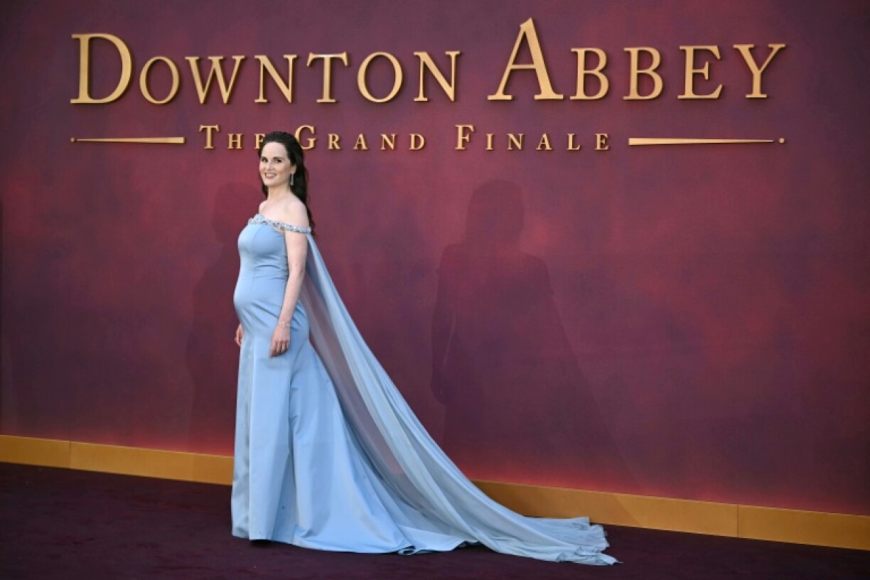 A pregnant Michelle Dockery poses on the red carpet at the world premiere of the film