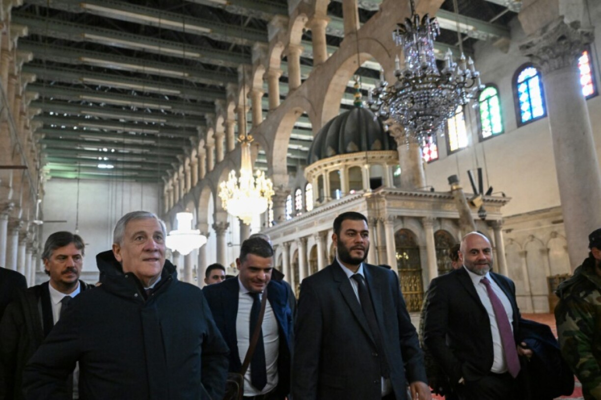 Italian Foreign Minister Antonio Tajani (2nd L) visits the eighth-century Umayyad Mosque in the old city of Damascus