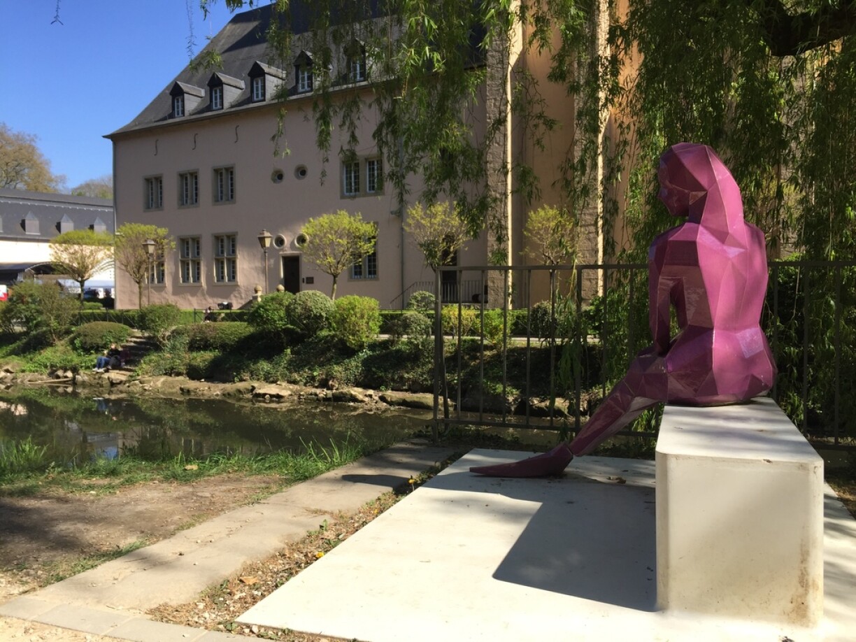 Melusina sitting on the shore of the Alzette river, in the same spot where the tragedy is rumoured to have unfolded centuries ago. The sculpture by Luxembourgish artist Serge Ecker was designed on a computer and printed in 3D.