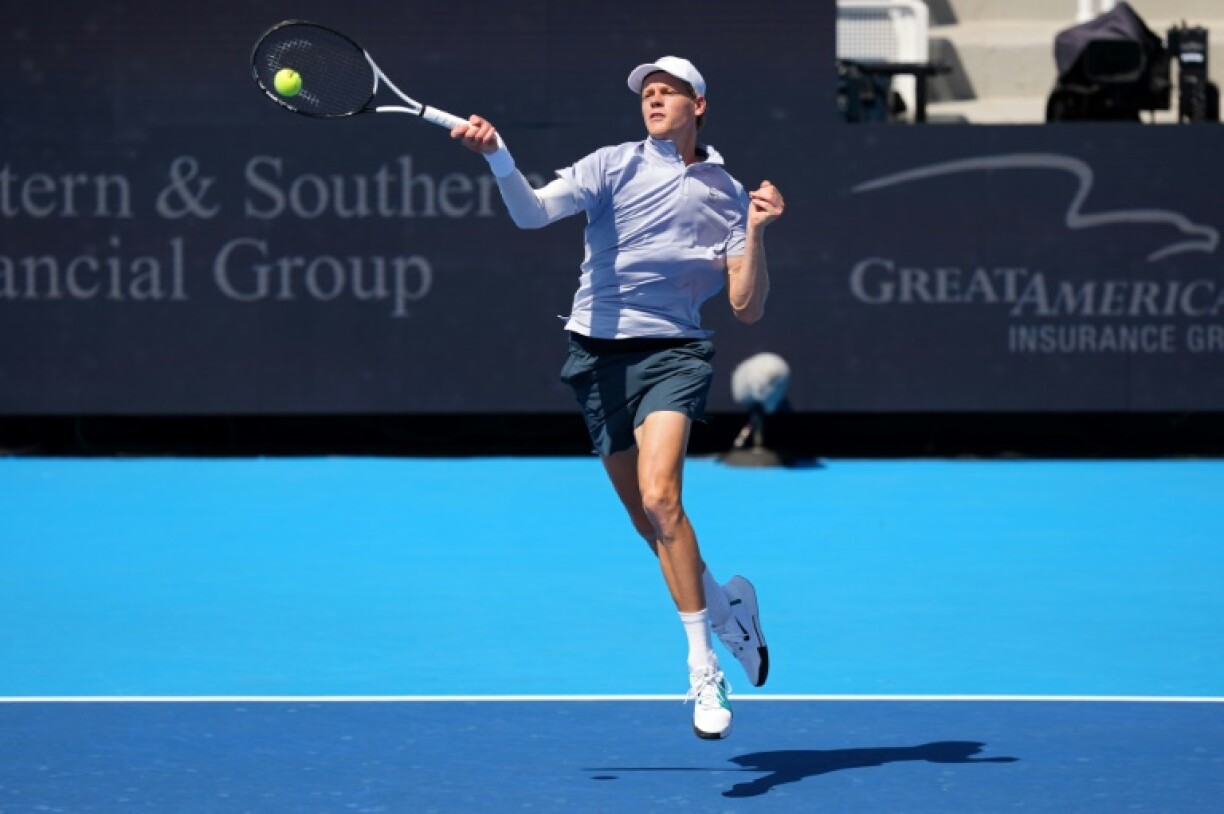 Jannik Sinner returns a forehand on his way to defeat against Carlos Alcaraz in the Cincinnati Open final