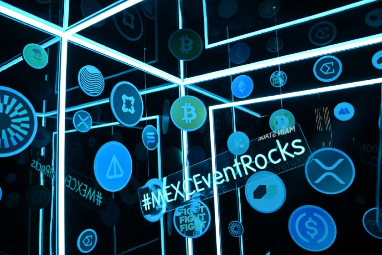 Logos of different cryptocurrencies are displayed during the Token2049 conference in Dubai in April