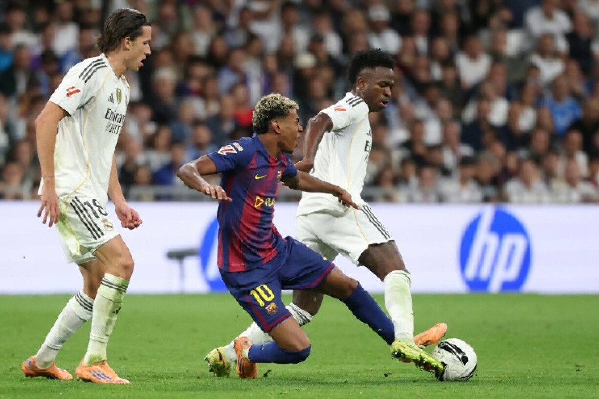 Vinicius Junior and Lamine Yamal fight for the ball during last weekend's Clasico, in which Real Madrid beat Barcelona 2-1