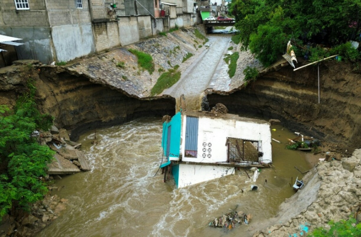 Heavy rains ahead of the storm led to a landslide that destroyed a house in Acapulco