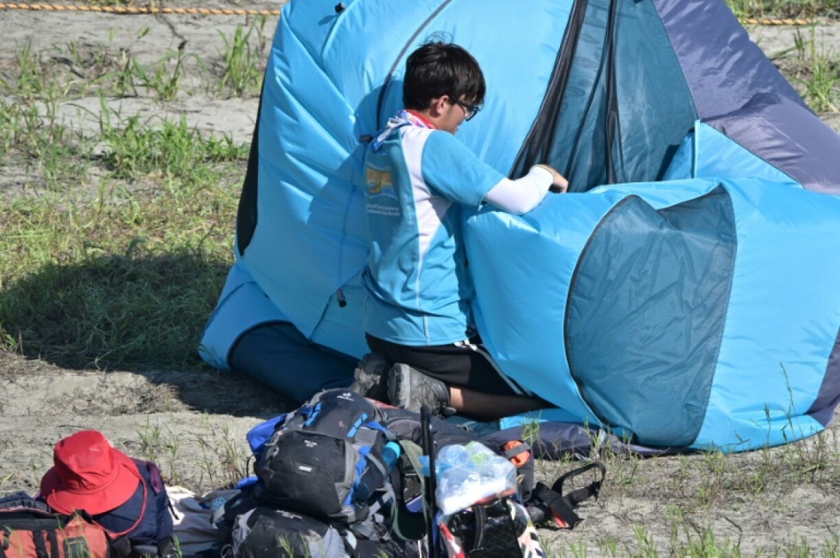 At the sprawling campsite in Buan Tuesday, tens of thousands of scouts were packing up their tents and belongings and queuing up to get onto buses bound for alternative accommodation in Seoul