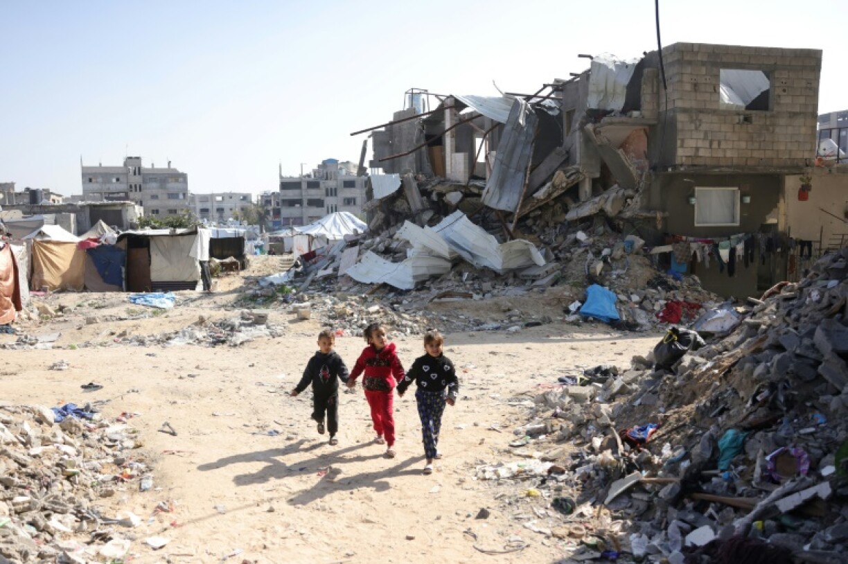 Palestinian children play among the rubble in Jabalia, northern Gaza