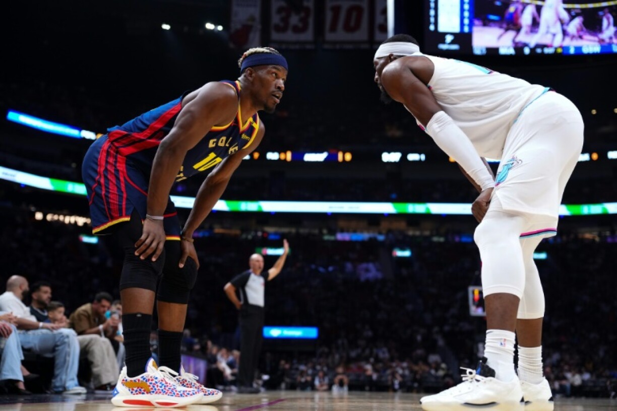 Golden State's Jimmy Butler (left) comes face-to-face with Miami'sBam Adebayo in his first game against his former club since his departure last month